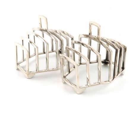 A pair of Art Deco silver seven-bar toast racks,by Synyer &amp; Beddoes, Birmingham 1937,shaped rectangular form, central car