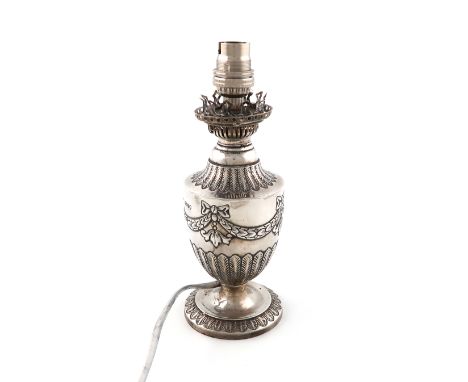 A Victorian silver oil lamp,maker's mark over-stamped, London 1888,baluster form, ribbon-tied swag decoration, on a raised we
