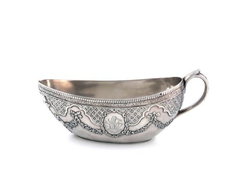 A 19th century French silver Bourdaloue, stamped with earlier pseudo marks, oval form, scroll handle, engraved, chased and ap