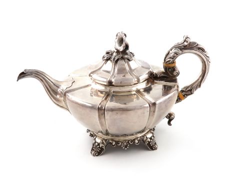 λAn early Victorian silver teapot, by Thomas Merrick, London 1837, lobed tapering circular form, leaf-capped scroll handle wi