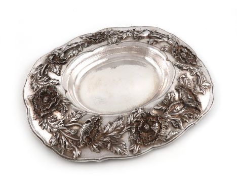 By Latino Movio for Holland, Aldewinkle and Slater, an Edwardian Arts and Crafts Britannia standard silver sideboard dish/bas