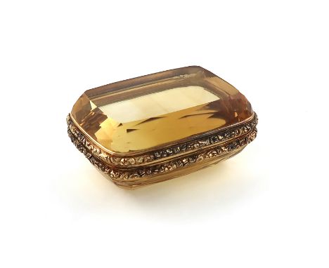 An early 19th century gold-mounted citrine snuff box, unmarked, English or Scottish, circa 1835, rounded rectangular form, fo