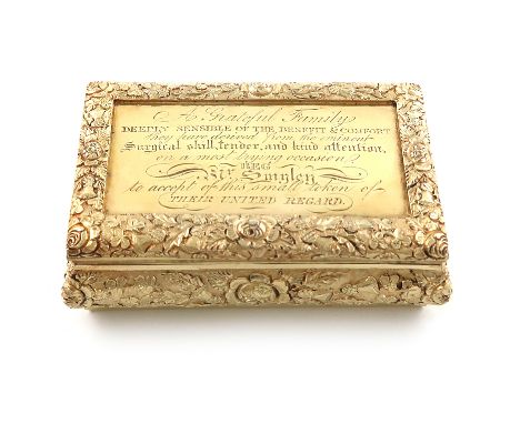 A George IV Irish presentation silver-gilt snuff box, by Henry Flavell, Dublin 1827, rectangular cushion form, the sides and 