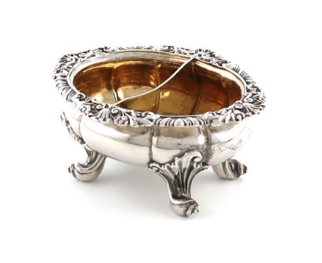 A George IV silver salt cellar, by Paul Storr, London 1826, oval form, foliate shell and gadroon border, the gilded centre wi