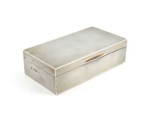 A modern silver cigarette box,by Garrard and Co., London 1959,rectangular form, engine-turned decoration, plain thumb-piece, 