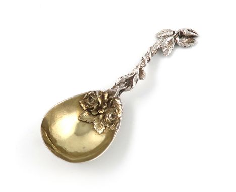 A Victorian cast parcel-gilt silver caddy spoon,by Francis Higgins, London 1865,fig-shaped bowl, foliate branch and rose hand
