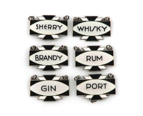 A set of six Art Deco silver and enamel wine labels, by Turner & Simpson, Birmingham 1933, shaped rectangular form, with blac