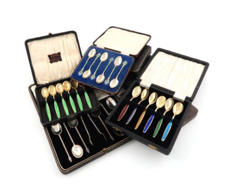 Please note: the image is incorrect in the printed catalogue.A collection of six cased sets of silver flatware, comprising: a