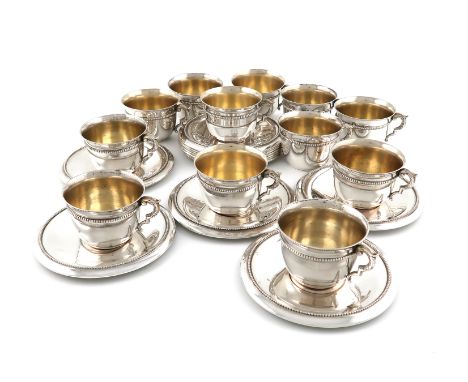 A set of twelve modern Italian silver cups and saucers,by A. Grandis, Rome, tapering circular form, foliate scroll handles, c