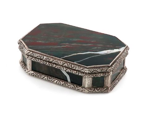 A 19th century silver and agate box,unmarked,rectangular form, canted corners, the mounts with foliate scroll decoration, hin