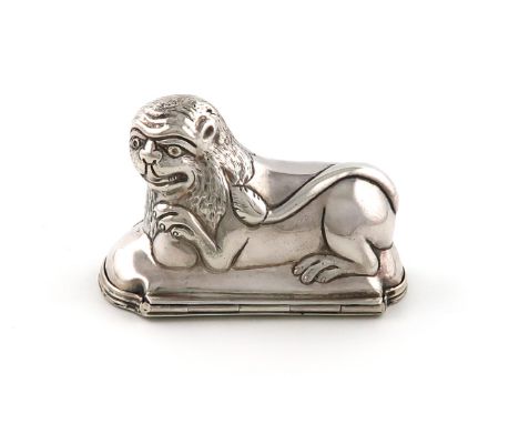 A silver lion snuff box, unmarked, probably German, late 18th century, modelled as a lying lion, the hinged base with a folia