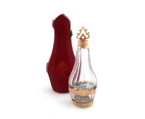 An 18th century gold-mounted glass scent bottle, unmarked, probably French, circa 1770, faceted baluster form, the glass with