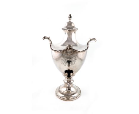 A George III silver tea urn, by Francis Butty and Nicholas Dumee, London 1769, vase form, the pull-off handle with a flame fi