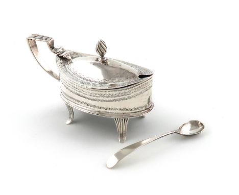 A George III Irish silver mustard pot, possibly by Joseph Jackson, Dublin 1799, oval form, engraved decoration, reeded scroll
