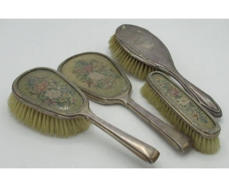 Geo.V hallmarked sterling silver mounted dressing table set comprising hand mirror, clothes brush and hairbrush inset with ne