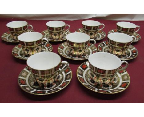 Nine Royal Crown Derby Imari 1128 pattern, cups and saucers (some cups with hairlines) 