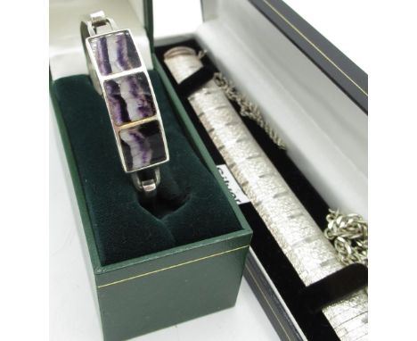 C21st hallmarked sterling silver and blue john bangle, three square tiles inset in silver hinged mount, on a silver band with