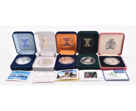 A collection of vintage 20th century Reserve Bank of New Zealand 5$ dollars .925 &amp; .999 sterling silver proof coins. The 