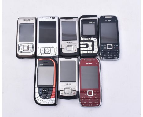 A collection of eight Nokia vintage early 2000s mobile telephone / cell phones, each with E.161 keypad and camera to verso.&n