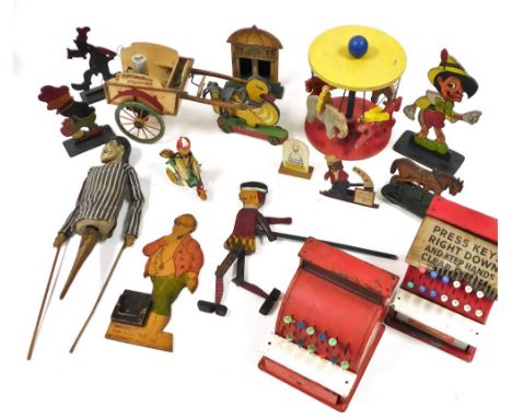 Vintage toys, including two St Michael tin plate imperial tills, Japanese tin plate and celluloid clock work boy on a tricycl