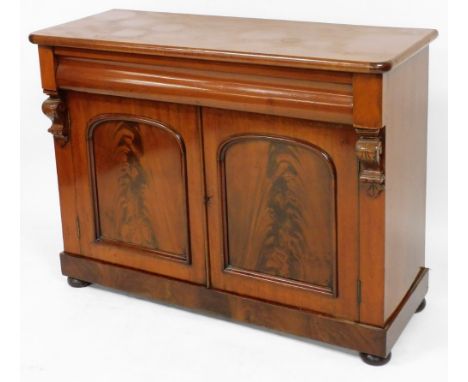 A Victorian mahogany sideboard, with a cushion drawer over a pair of panelled doors opening to reveal a single shelf, raised 