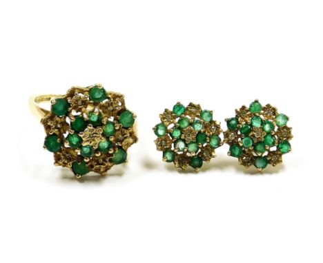 A 9ct gold emerald and diamond ring, in a tiered flower head basket setting, size O, together with a pair of matching earring