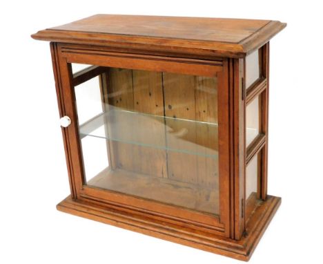 A Victorian pine display case, with glazed front and sides, enclosing a single glass shelf, 40cm high, 43cm wide, 21cm deep. 