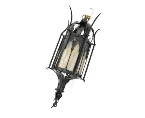 A Victorian Gothic style wrought iron hanging lantern, of hexagonal form, inset glass panels, 62cm high. 