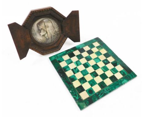 A malachite and white marble chess board, 27.5cm wide, together with an early 20thC silver plated Regina Coeli circular devot