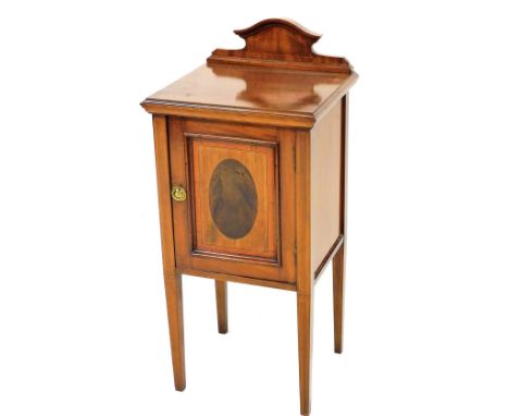 An Edwardian mahogany and satinwood crossbanded pot cupboard, the raised back with a moulded edge and a panelled door enclosi