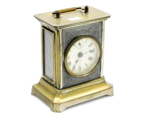 A German Junghans brass finish carriage clock, with paper Roman numeric dial and loop handle, 16cm high.