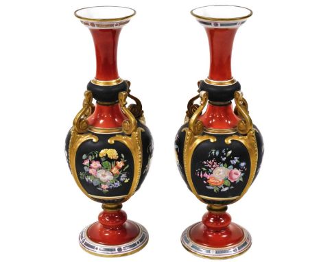 A pair of 19thC Ashworth ironstone vases, each with a tapering flared rim and bulbous body, with four scroll supports connect