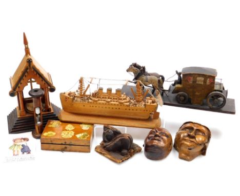 A vintage carved model of a coach and two horses, cruise liner, masks, reliquary, bobbin egg timer and a decoupage box contai
