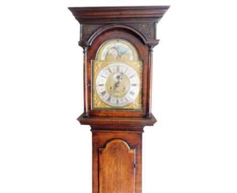 A George II oak longcase clock, by Thomas Smallwood of Sandbach, the break arch pediment with moon phase dial, brass face wit