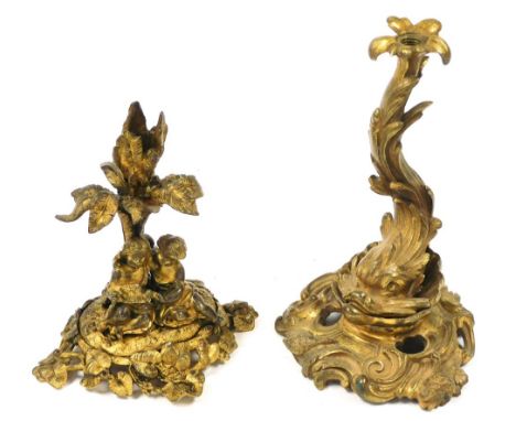 A late 19thC Continental ormolu candle holder, of branch form fronted by two children and a dove, raised on an oval leaf scro