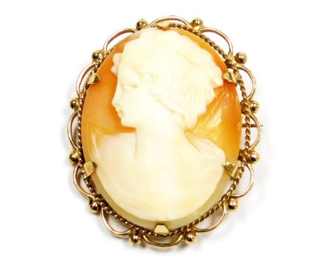 A 9ct gold and shell cameo brooch, bust portrait of a lady, with safety chain as fitted.