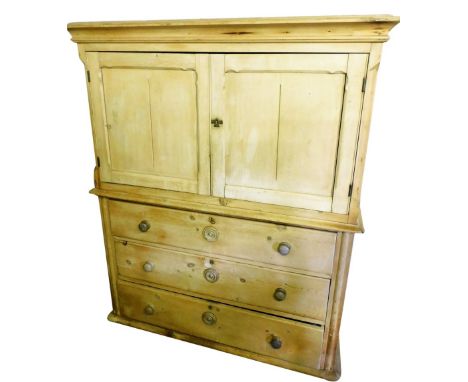 A Victorian pine kitchen dresser, the outswept pediment over a pair of panelled doors, enclosing a single shelf over three lo