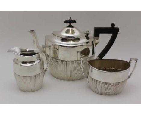 JAMES DIXON &amp; SONS LTD, AN EDWARDIAN THREE-PIECE SILVER TEA SET OF GEORGIAN DESIGN, comprising; teapot, milk jug, and sug