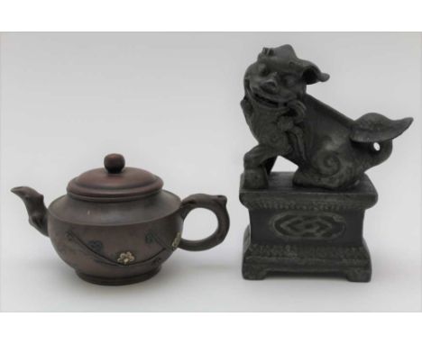 A CHINESE RED WARE TEAPOT, moulded briar handle and spout, blossom design applied to the body with cover, impressed character