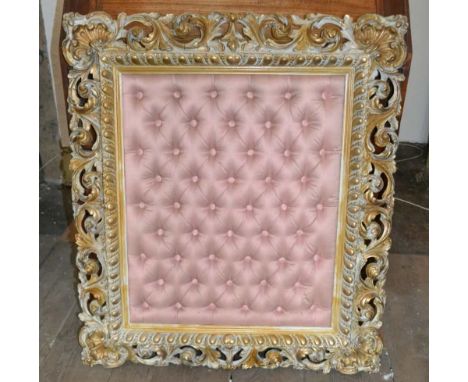 A GILDED FRAME WITH PINK FABRIC BUTTON PANEL INSIDE 52cm x 37cm 