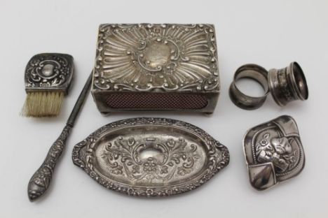 A LATE VICTORIAN SILVER MATCHBOX HOLDER, repousse decoration, raised on ball feet, 7.5cm x 5cm, Birmingham 1899, together wit
