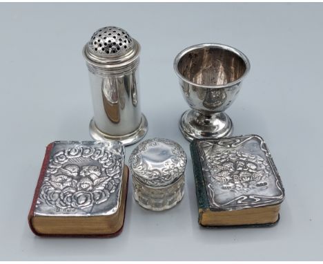 A London silver sander together with a Birmingham silver eggcup, a silver mounted and glass dressing table bottle and two sil