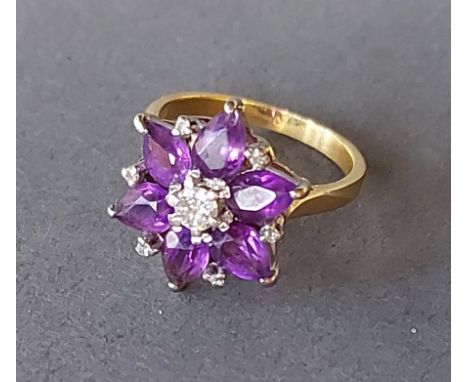 An 18ct gold ring set with a central diamond surrounded by Amethysts, 6.5gms 