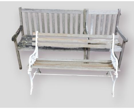 A teak garden bench with slatted back and seat together with a matching armchair and metal framed garden bench 