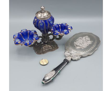 An 900 mark silver backed mirror together with a 925 and enamel locket and a table centre 