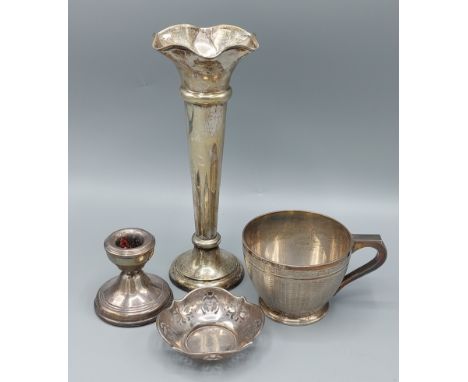 A Birmingham Silver teacup with engine turned decoration, 4ozs, together with a silver spill vase a silver squat candlestick 