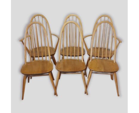 A set of six Ercol blonde ash stick back dining chairs comprising two armchairs and four singles 