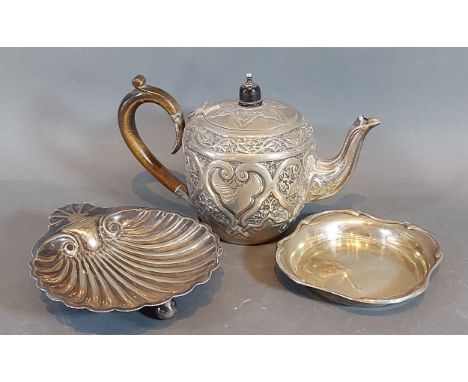 A Victorian silver small teapot of embossed form, Sheffield 1885, together with a Sheffield silver butter dish of scallop for