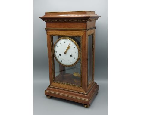 A 19th Century French library clock, the enamel dial inscribed Bourret A Paris, with Arabic numerals and two train movement s