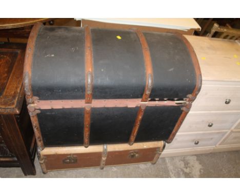 AN OAK BOUND PACKING TRUNK TOGETHER WITH AN OAK BOUND DOMED TRUNK